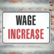 a sign that says wage increase on it
