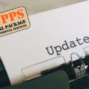 a close up of a typewriter with a sign on it