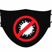 a black and red mask with a red circle in the middle