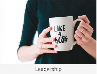 a woman holding a coffee mug with the words like a boss on it