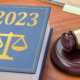 Other HR Changes to Come to California in 2023 - A gavel and law book with 2023 on the cover